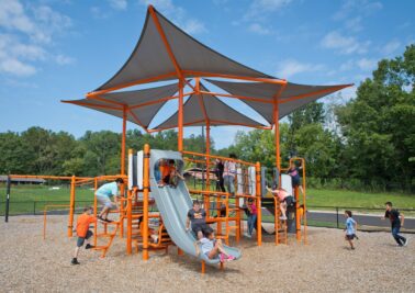 compact play structure with built in shade