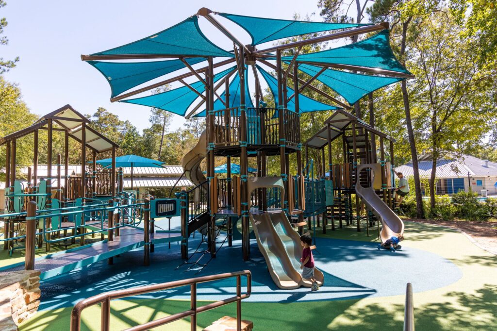 shade covers a playground with children playing to reduce heat effects